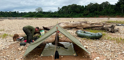 Hammock setup on the beach on the Tambopata River